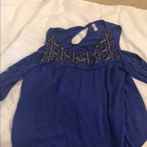 Blue shirt with wholes where shoulders go